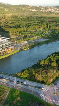 Artificial Lake Integrated with Modern Technology Buildings and Green Infrastructure in Florian&oacute;polis, Brazil. Establishing Shot. Aerial View.