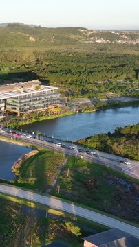 Artificial Lake Integrated with Modern Technology Buildings and Green Infrastructure in Florian&oacute;polis, Brazil. Establishing Shot. Aerial View.