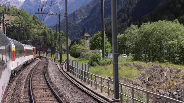 Lugano, Switzerland - 21 August 2026: View of the Gotthard Panorama Express train traveling along the scenic railway tracks in the Ticino region.