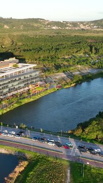 Artificial Lake Integrated with Sustainable Infrastructure, Modern Buildings and Preserved Green Landscape in Florian&oacute;polis, Brazil. Establishing Shot. Aerial View.