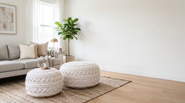 Modern minimalist living room with white knitted poufs and empty wall space