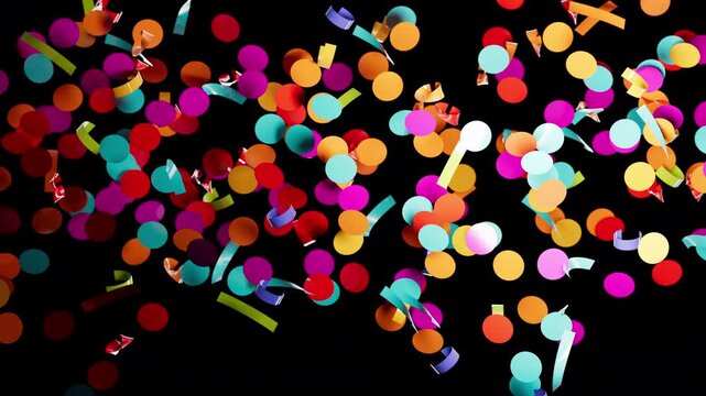 Bright paper circles and ribbons showering down for festive event.