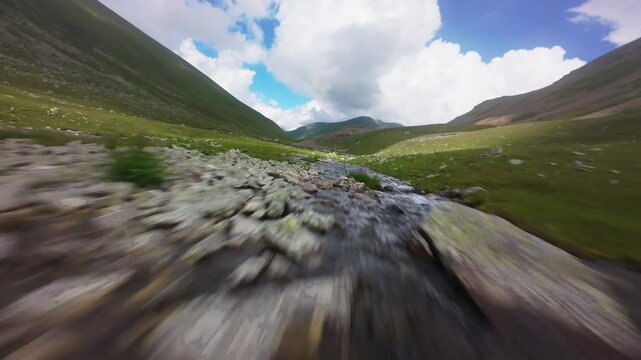 Fast forward movement along a winding river in a mountain valley