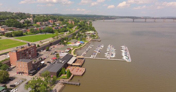 Newburgh riverfront marina with houses, college and bridge in New York