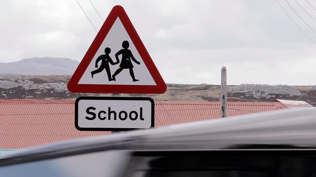 Road Sign For School Crossing And Speed Limit In Falkland Islands (Islas Malvinas) - 4K