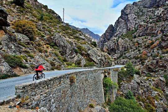 Corsica - view of the cyclist in the canyon river Golo