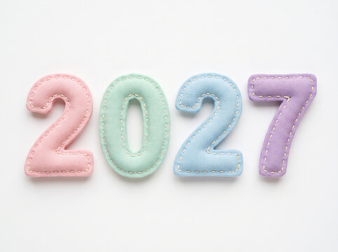 2027 New Year Celebration Concept with Plush Pastel Felt Numbers Confetti and Ribbons Flatlay 2