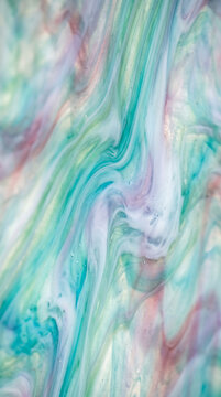 Swirling ethereal pastel glass texture featuring delicate marbled patterns of light blue green and soft lavender