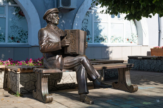 YELETS, RUSSIA - JULY 3, 2026: The genre sculpture "Accordionist with a Yelets accordion" on a sunny July day. Yelets, Lipetsk Oblast