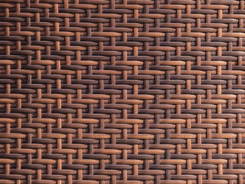 Synthetic rattan material creating a seamless interwoven pattern with contrasting shades of brown and tan, offering a durable and decorative surface texture