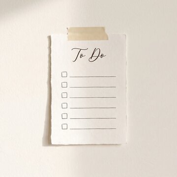Blank to do list card taped to a wall for productivity planning and task management