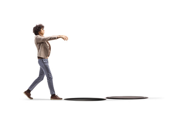 Man sleepwalking towards a hole