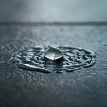 Closeup photo of water drop on ceramic tile Canon EOS 100mm Macro lens