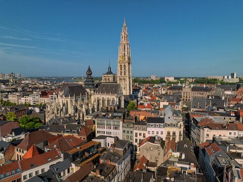 Aerial view of the Cathedral of Our Lady rising above the historic rooftops and urban landscape of Antwerp, Flanders, Belgium.