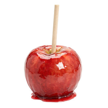 Shiny red candy apple coated in hard sugar glaze with a wooden stick inserted into the center isolated on a transparent background