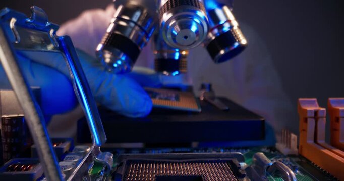 Macro probe close up of technician aligning microprocessor chip on motherboard, microchip component for inspection under microscope.