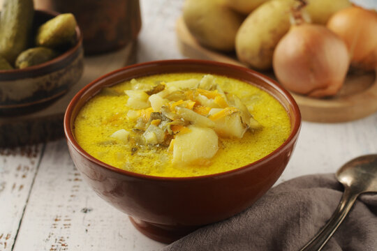 A bowl with traditional soup in Poland Zupa Ogorkowa