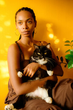 Young Black woman portrait in golden light