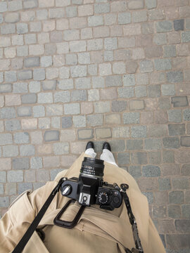 Top view of female photographer with vintage camera