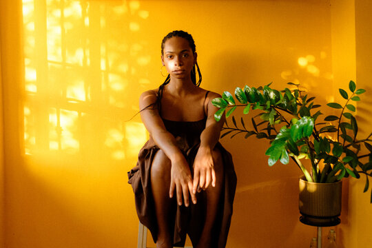 Young Black woman portrait in golden light