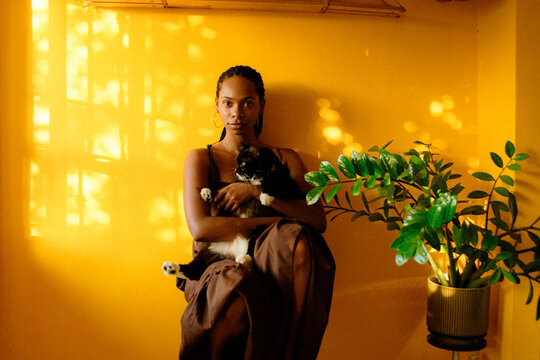Young Black woman portrait in golden light