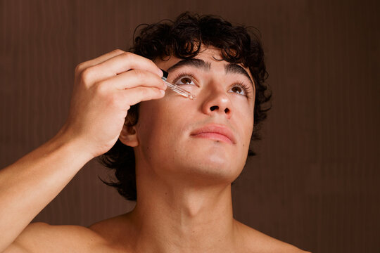 Applying a Serum to the Face in a Simple Indoor Setting