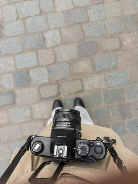 Top view of female photographer with vintage camera