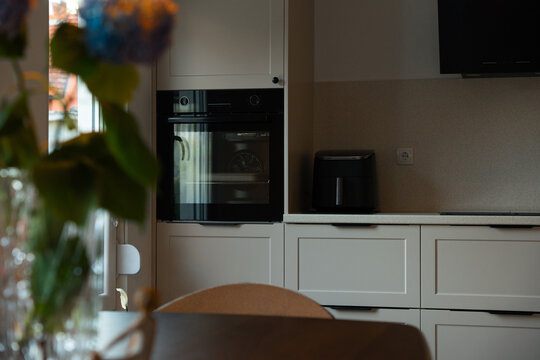 Modern Kitchen with Built-In Oven and Soft Natural Light