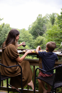 
Mother and Son Sharing a Meal Together on a Porch