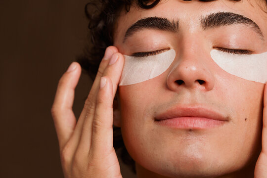 Man Applying Under-Eye Patches for Skincare Routine