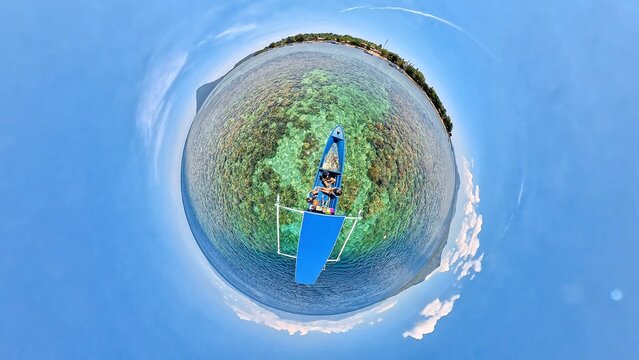 Aerial View of Boat on tropical Island. Tiny planet