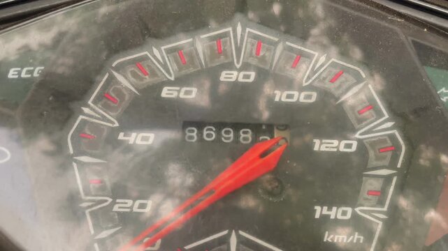 Motorcycle speedometer gauge panel closeup with engine turned off