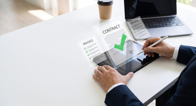 Businessman using stylus on tablet for digital e-signature and virtual contract approval, Paperless office and smart contract management concept with holographic invoice documents.