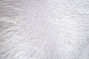 Close-up of white fluffy textured woolen fabric background © ornax photo