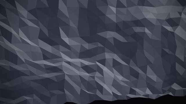 Abstract low poly geometric background with dark grey triangular shapes and soft lighting