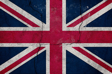 Fototapeta premium Flag of the United Kingdom with a Deeply Textured and Cracked Grunge Effect Symbolizing National Identity and Historical Resilience on a Weathered Wall Surface