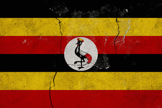 Uganda National Flag with a Distressed Grunge Texture and Cracks Ideal for Patriotic Backgrounds and Graphic Designs Reflecting National Identity
