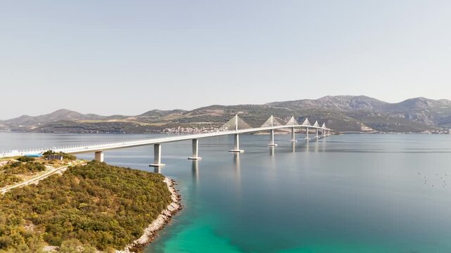An aerial view of the impressive Peljesac Bridge, connecting mainland Croatia with the Peljesac Peninsula across the Adriatic Sea.