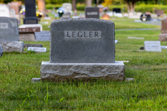 Gray granite Legler headstone with simple surname panel
