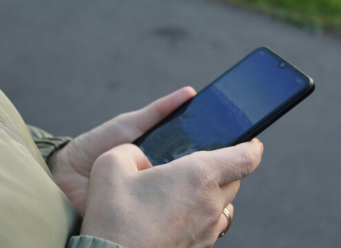 Hands Using Smartphone with Blank Screen for Digital Lifestyle Concept.

