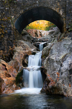 waterfall under rock bridge, blue ridge mountains