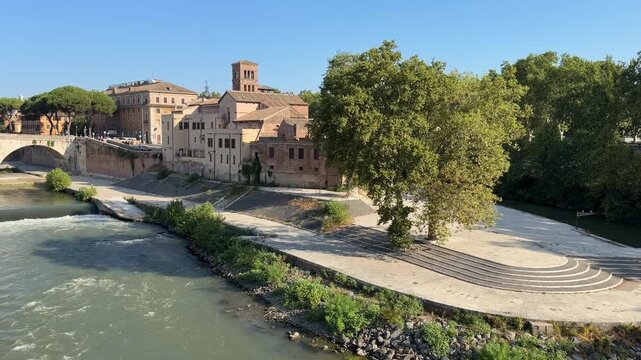 Horizontal pan of Tiber Island and Pons Aemilius Ponte Rotto from Palatine Bridge Rome