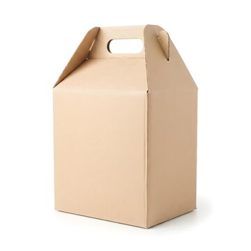 Empty cardboard carry box with handle on a white surface for takeout or delivery