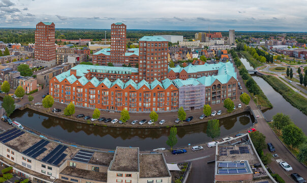 Aerial view of Amersfoort Vathorst skyline featuring modern residential buildings along a canal in The Netherlands.