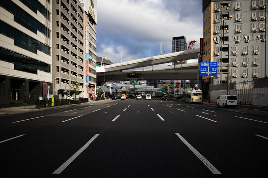 A wide and busy street in Osaka, Japan.
