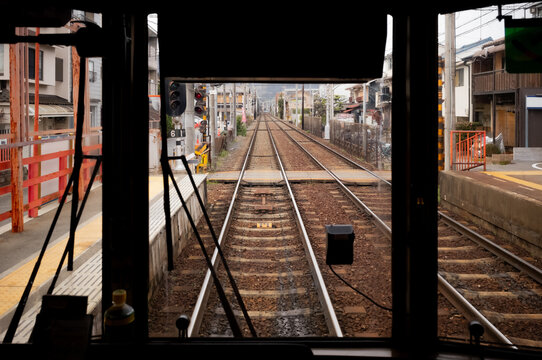 Riding a light rail trolley train in Kyoto, Japan.