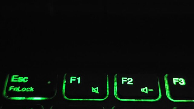 Close Up of Backlit Laptop Function Keys Glowing