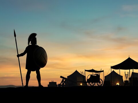 Ancient greek warrior silhouette at military camp sunset