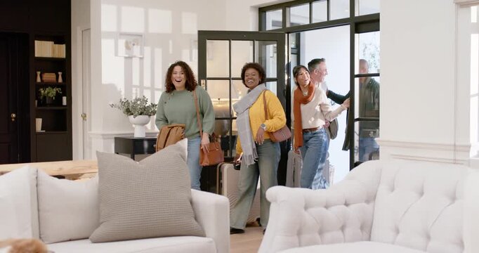 Diverse five travelers entering after front door opening for visit at home, luggage, petting dog