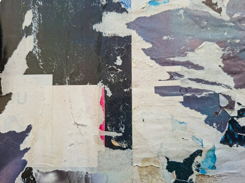 Grungy, torn, and ripped street poster background, messy old paper artistic texture